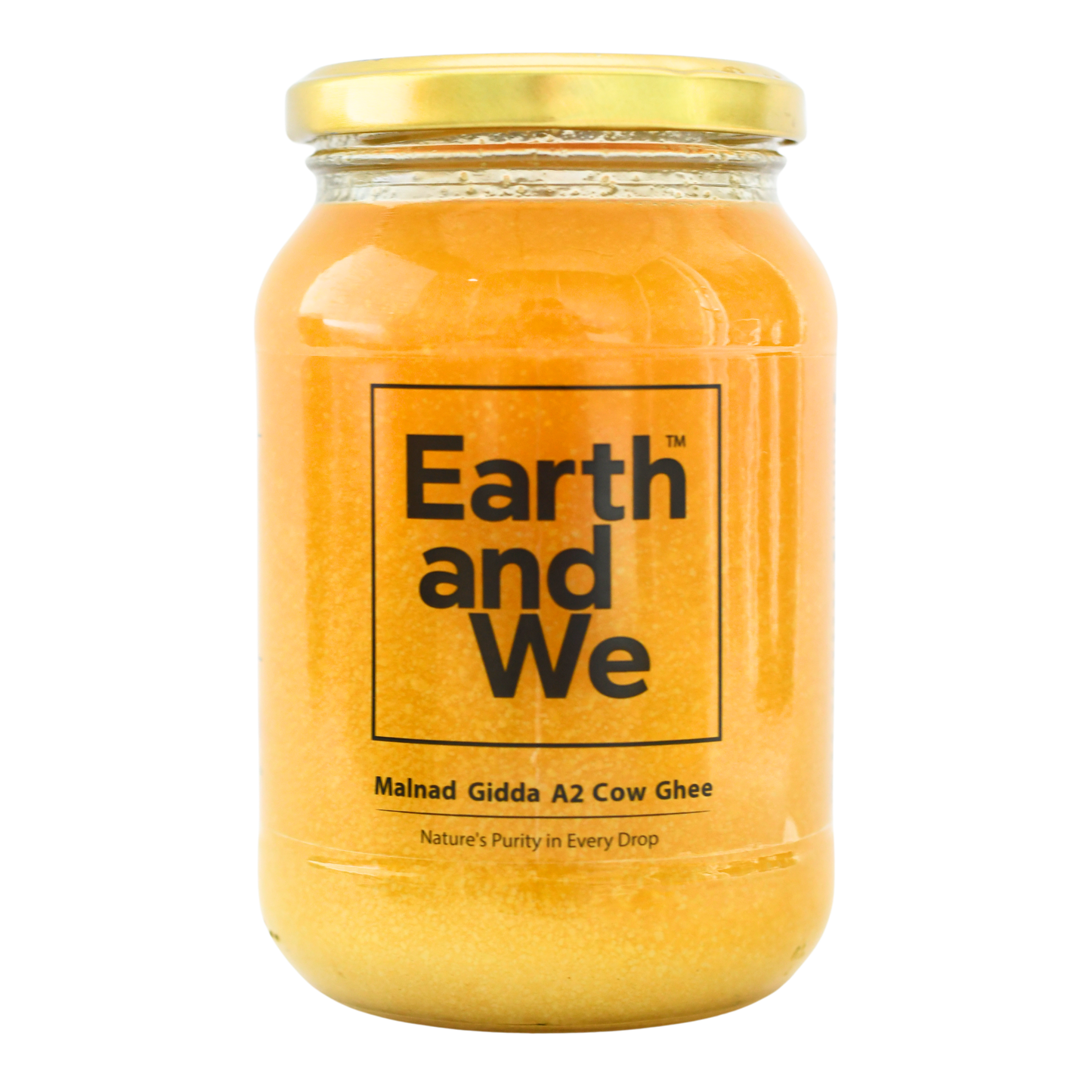 Jar of Malnad Gidda A2 Cow Ghee by Earth and We showcasing its rich color and purity.